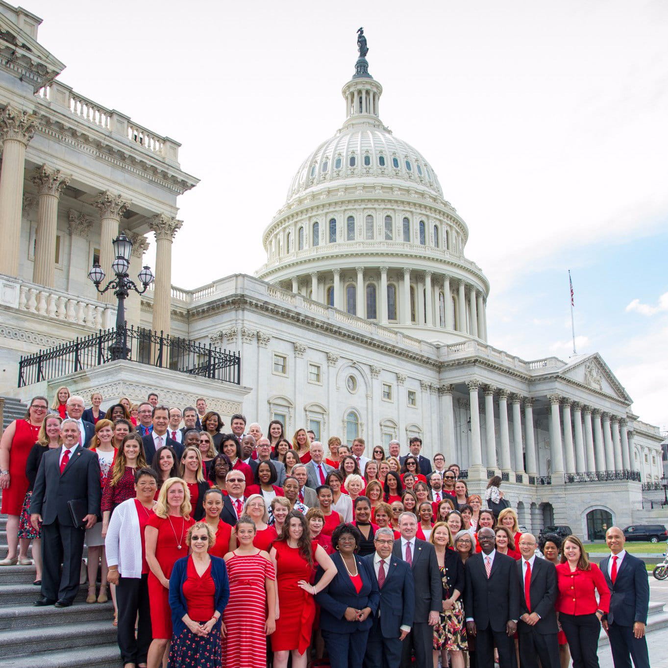 Diverse and well-dressed crowd in front of U.S. Capitol building