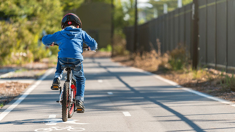 child riding bicycle