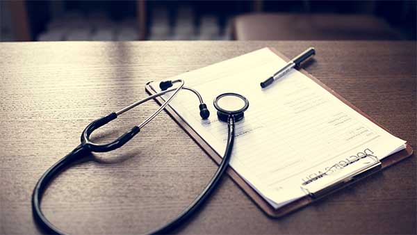 clipboard, stethoscope, and writing pen