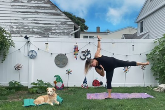 Real Women Class 2023 Dina Pinelli doing yoga outside