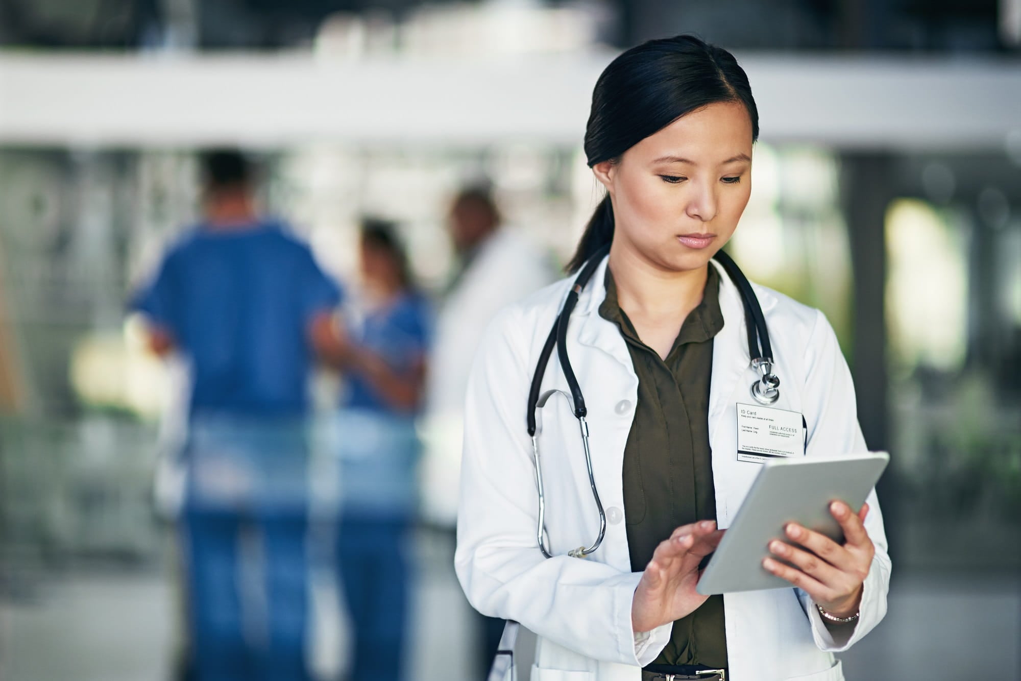 doctor reading tablet