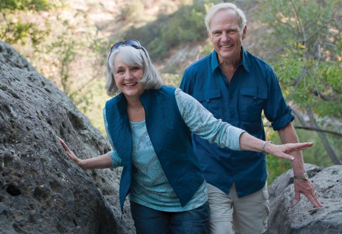 Couple hiking through a park