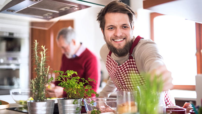 hipster son and dad cooking