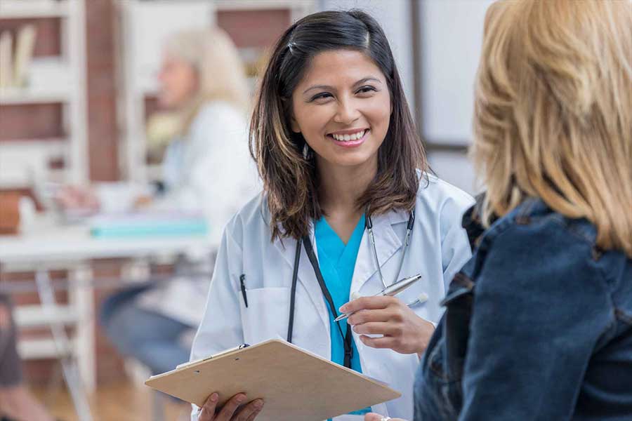 female doctor consulting with female patient