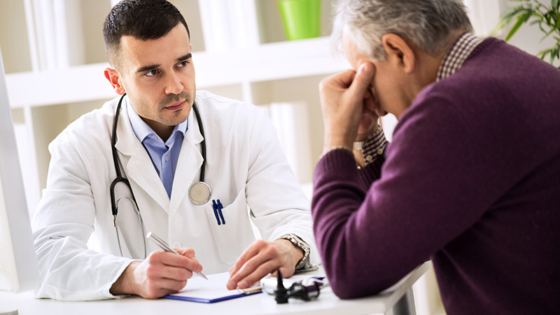 worried older man talking to doctor worried older man talking to doctor