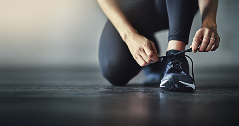 runner tying shoe GettyImages-618982838