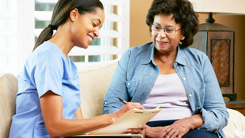 young nurse with senior patient